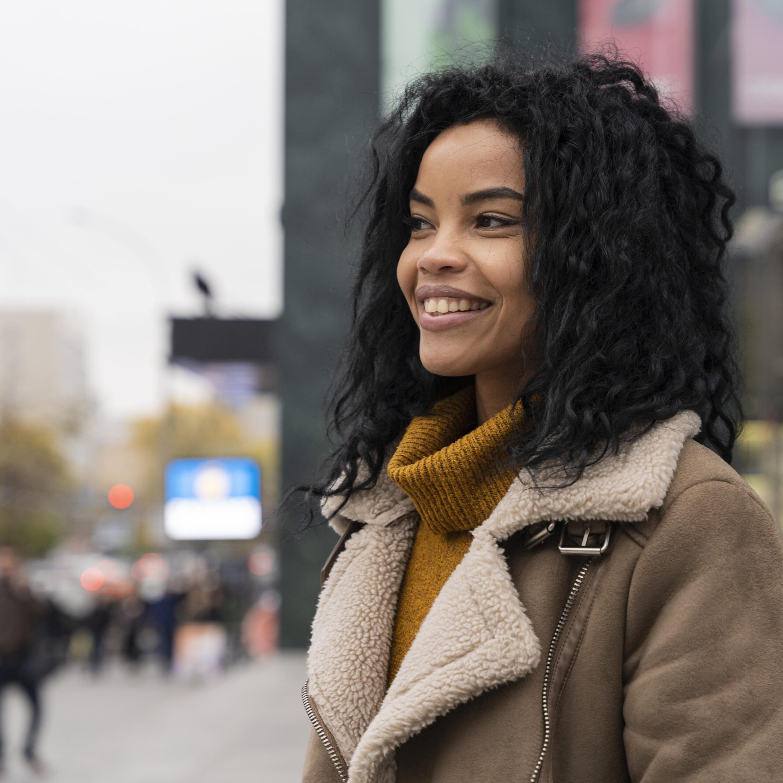 smiley-woman-looking-away-outdoors