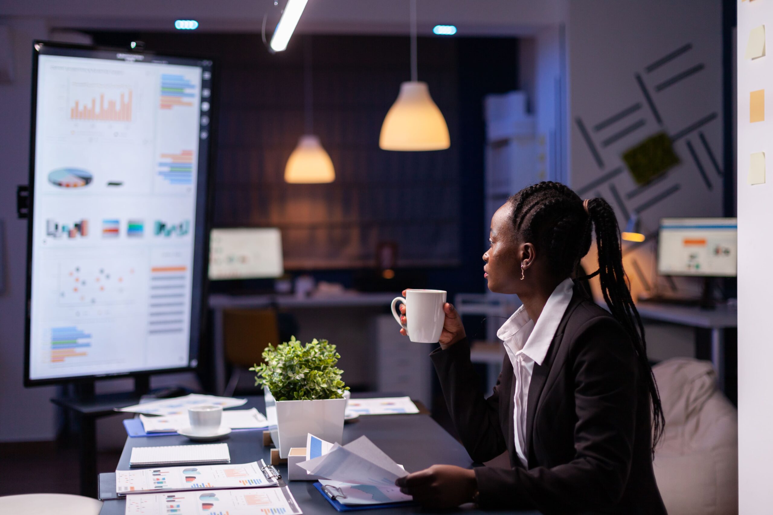 workaholic-african-american-businesswoman-analysing-marketing-statistics-paperwork